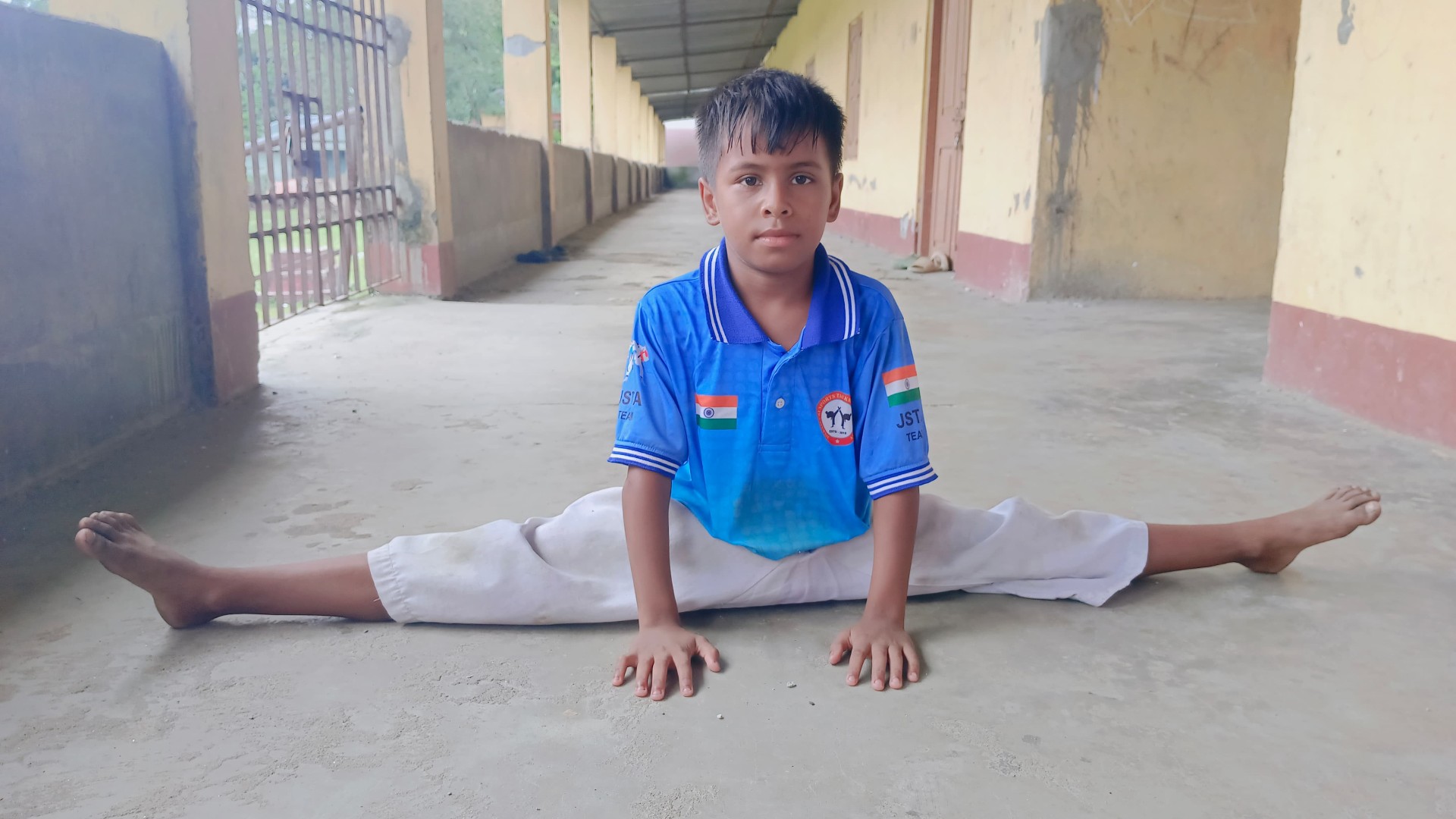 JSTA student performing a full split